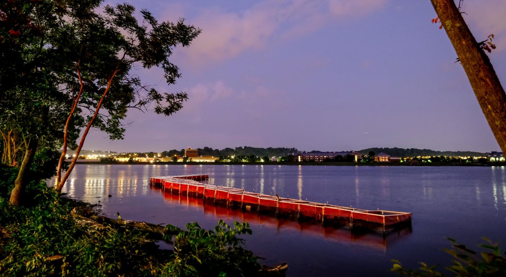 Close to the center of everything a body of water at night
