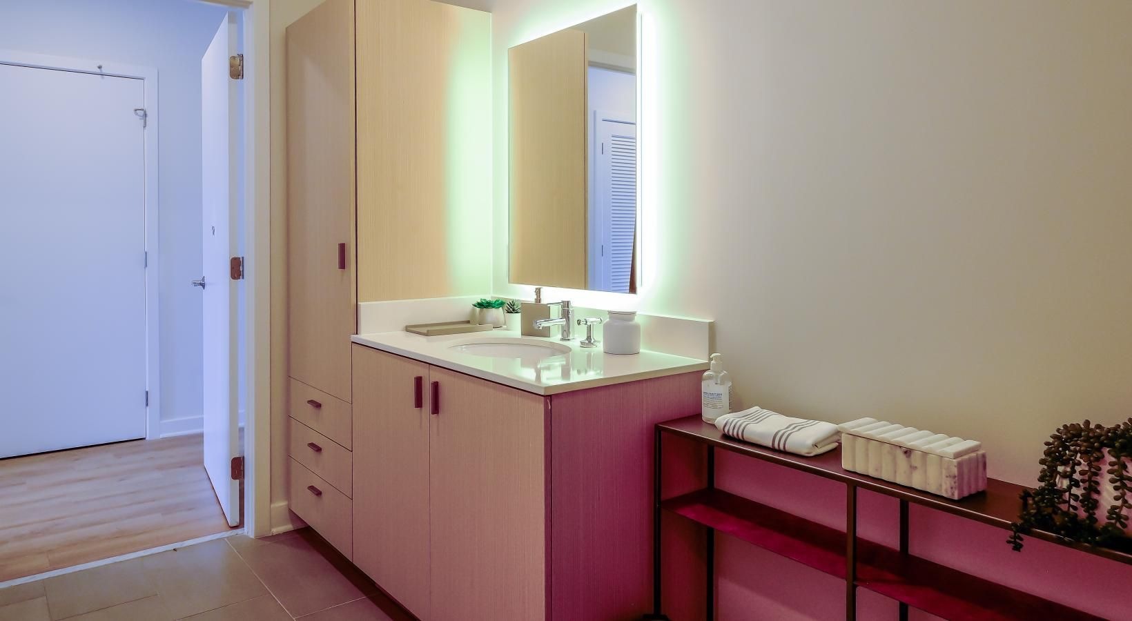 Bathroom options with thoughtful details backlit mirror over sink in bathroom