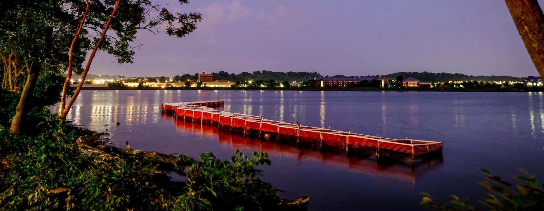 a body of water at night