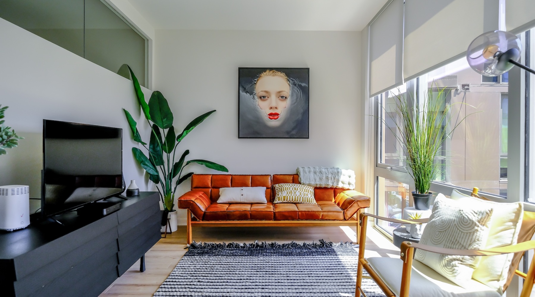 living room with a large window and open spaces