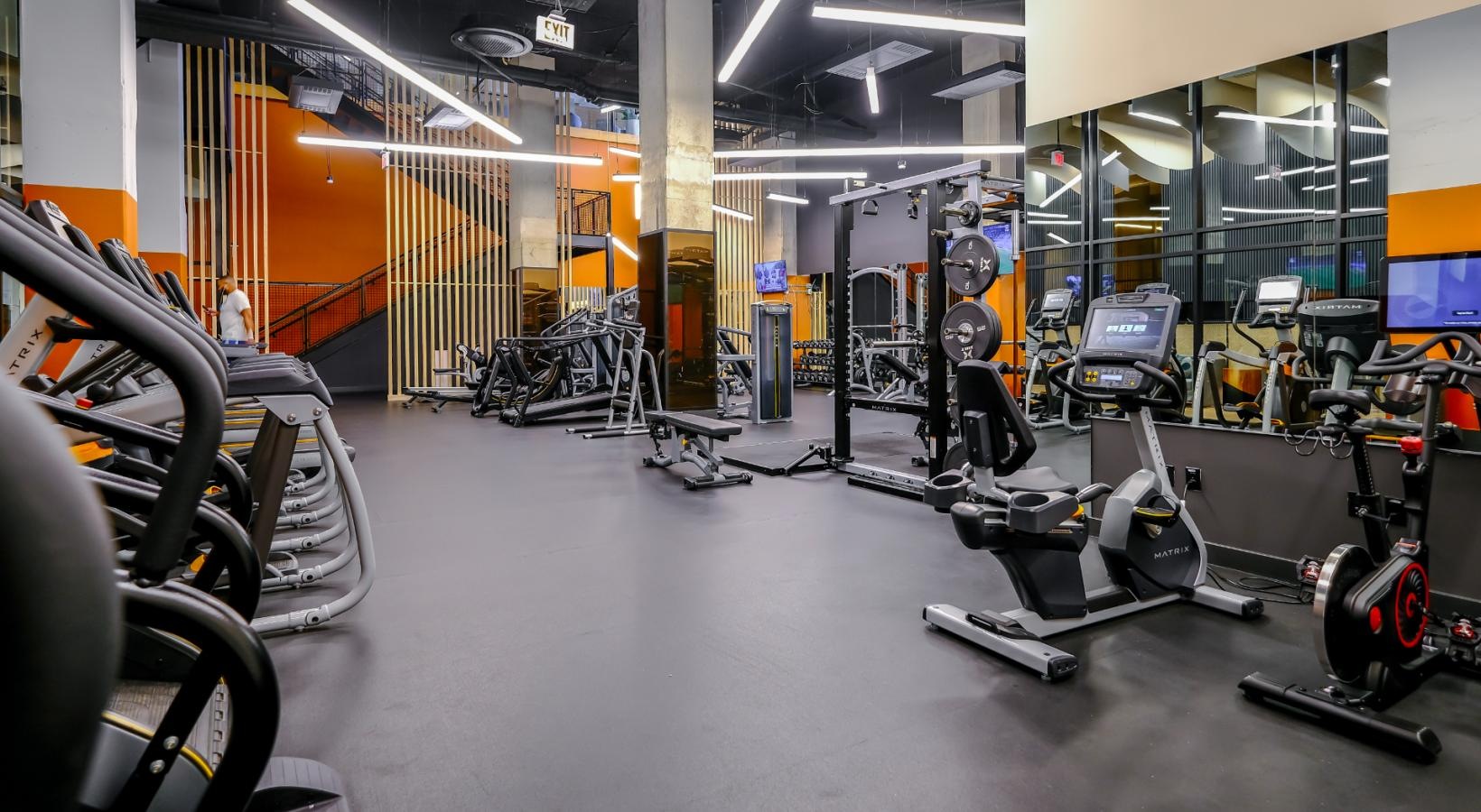 Cutting-edge amenities at your fingertips a gym with exercise equipment
