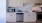 a kitchen with white cabinets