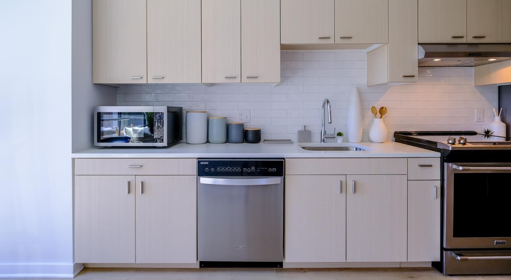 Spacious kitchens with thoughtful details a kitchen with white cabinets