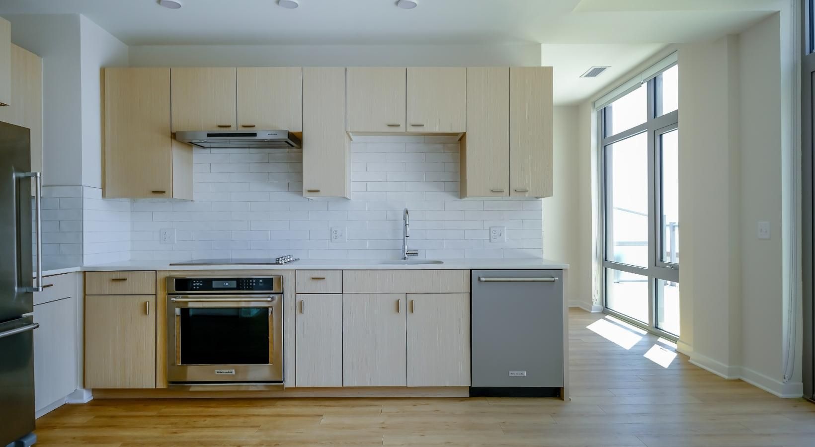 Beautiful kitchens with designer finishes a kitchen  wall with white cabinets