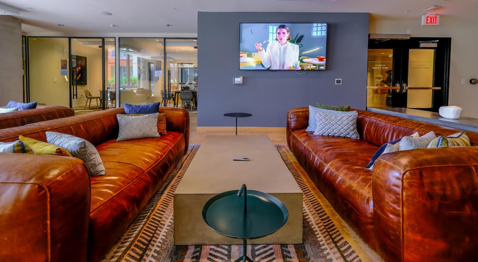 Find your perfect fit at Riverpoint clubroom with couches and wall mounted tv